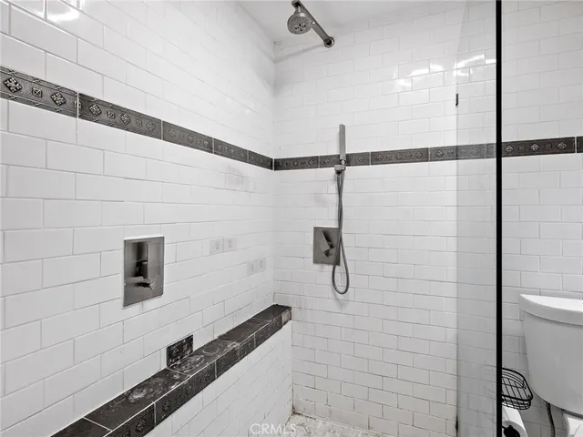 a bathroom with a toilet a sink and bathtub