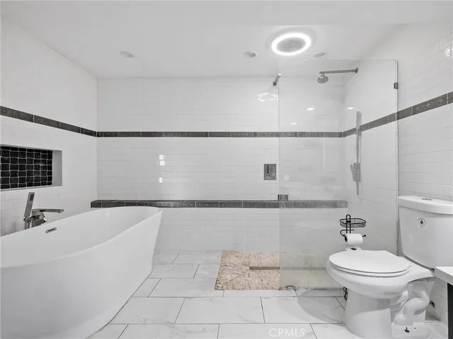 a bathroom with a bathtub and shower
