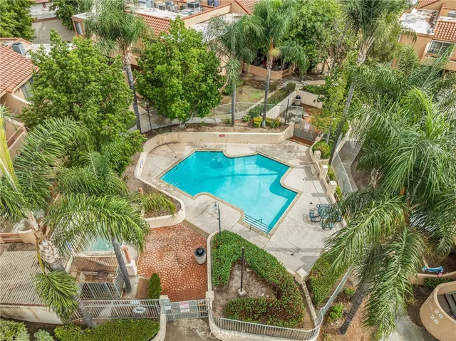 an aerial view of a house with a swimming pool