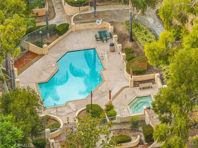 an aerial view of a pool patio swimming pool and outdoor seating