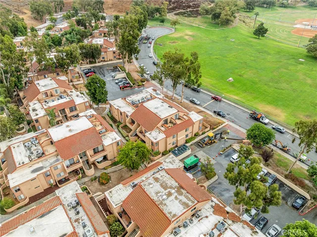 an aerial view of residential houses with outdoor space