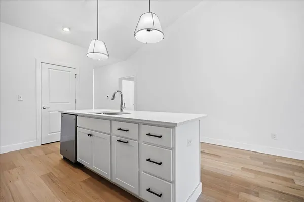 a spacious bathroom with a double vanity sink and a mirror