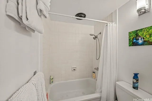 a bathroom with a shower and a bath tub