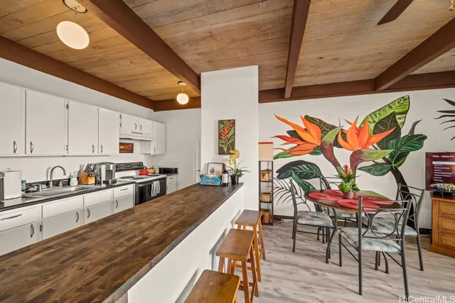 a kitchen with stainless steel appliances granite countertop a sink and cabinets
