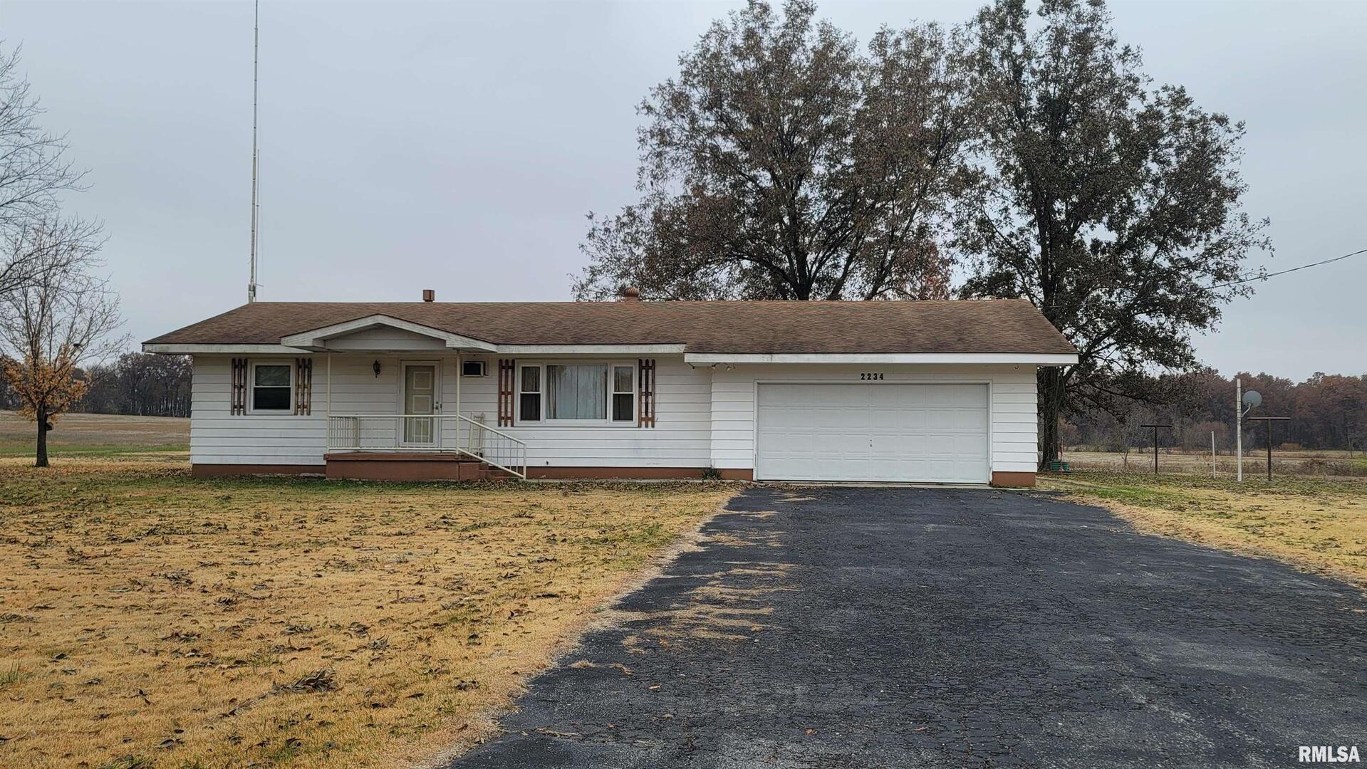 2234 Red Stripe Road Odin, IL 62870 - Photo 1 of 28 a front view of a house with a yard