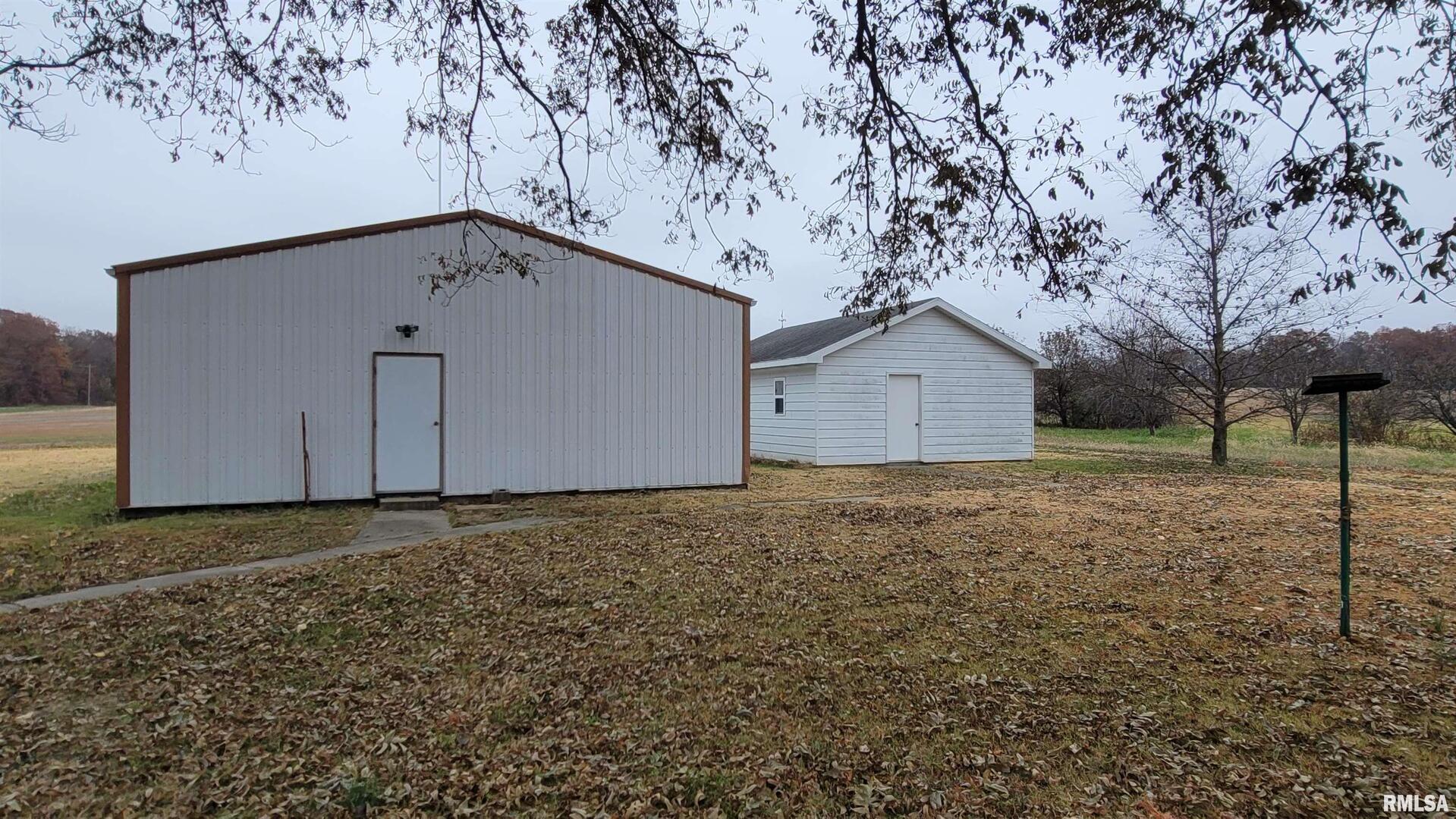 2234 Red Stripe Road Odin, IL 62870 - Photo 19 of 28 a house with trees in the background