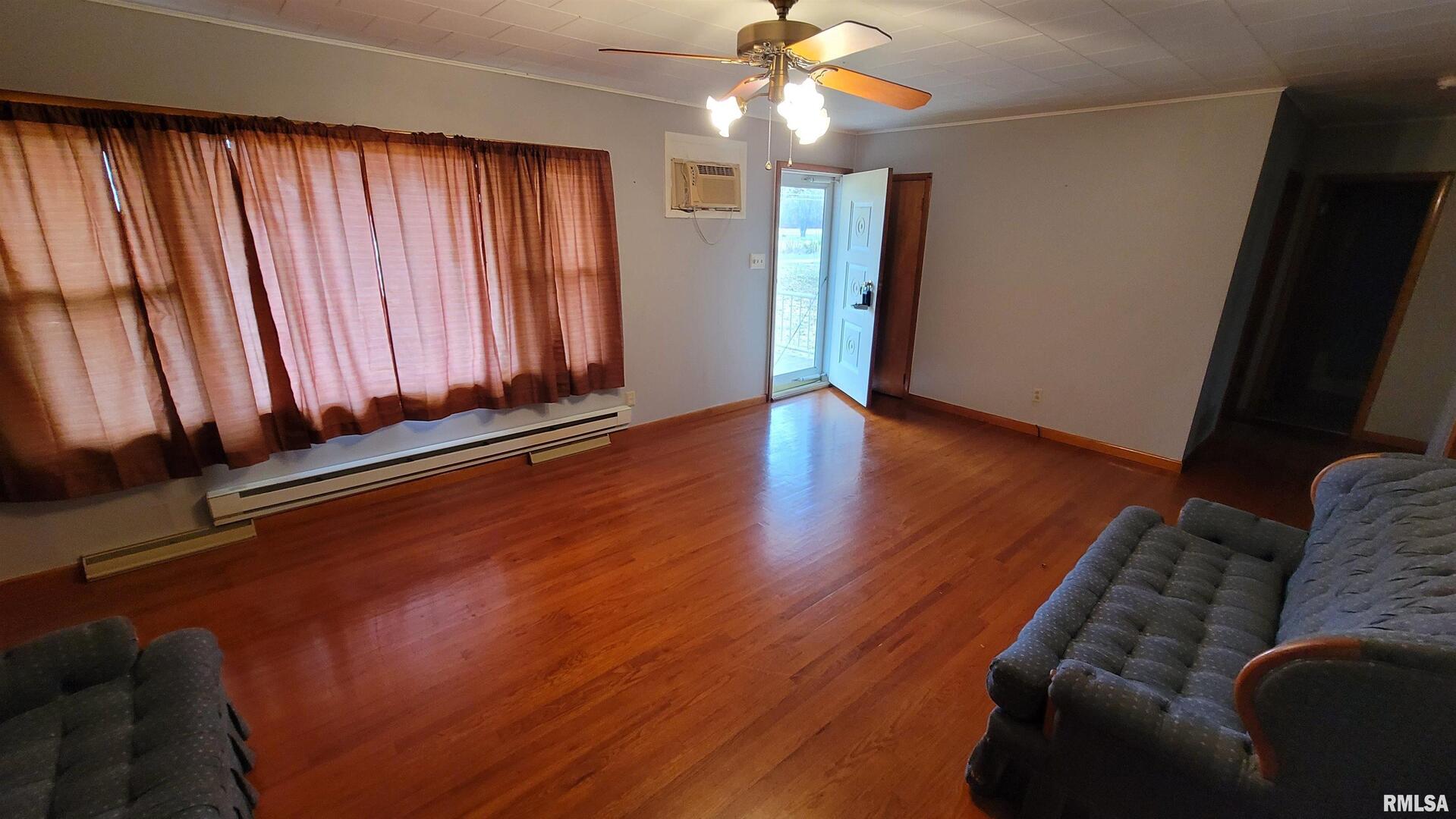 2234 Red Stripe Road Odin, IL 62870 - Photo 4 of 28 a living room with furniture and a chandelier