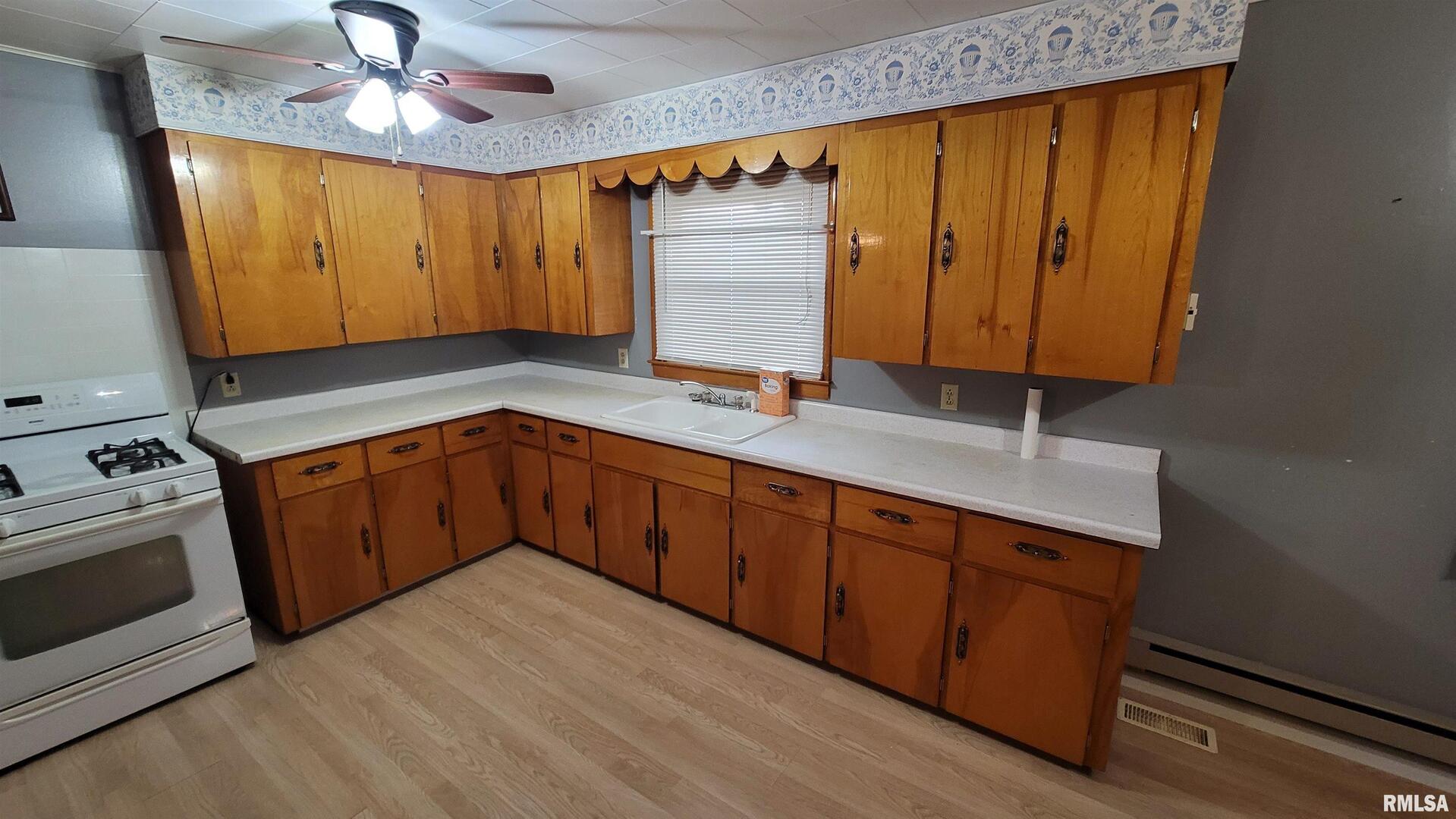 2234 Red Stripe Road Odin, IL 62870 - Photo 5 of 28 a kitchen with stainless steel appliances granite countertop wooden cabinets a sink and dishwasher