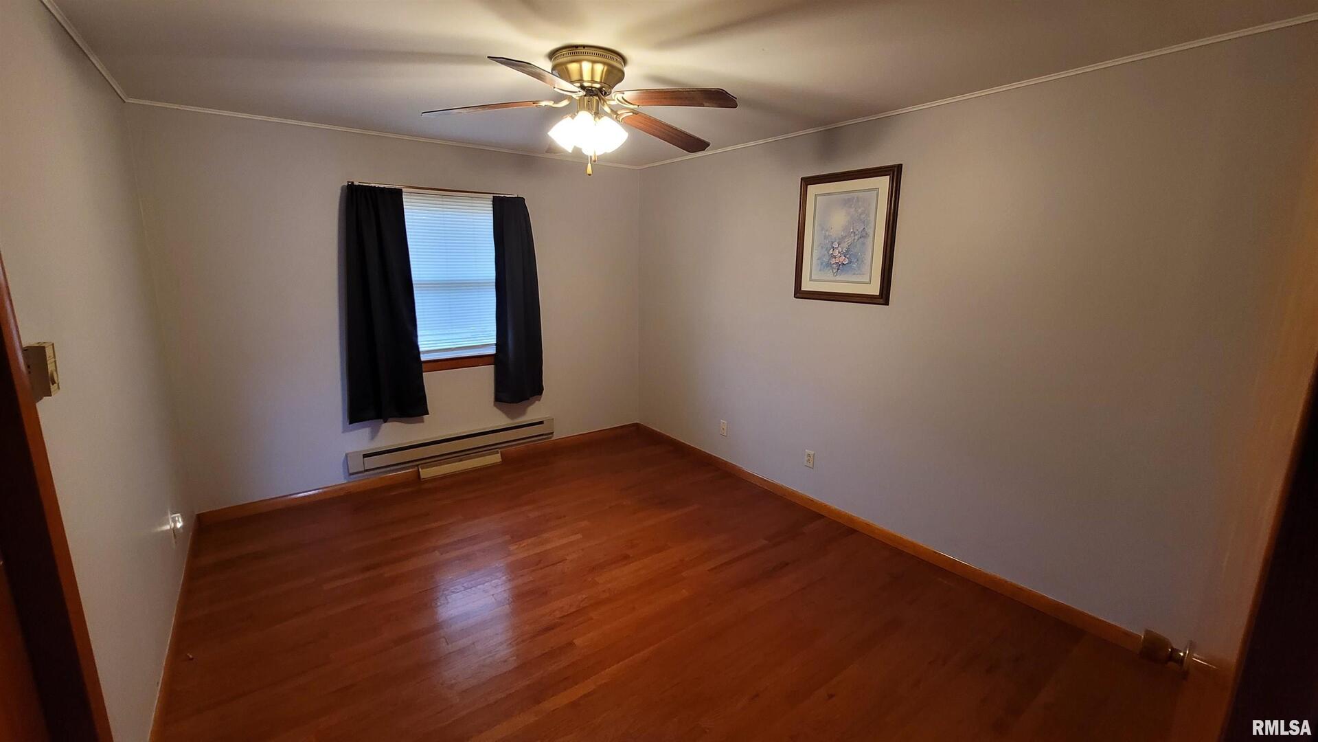 2234 Red Stripe Road Odin, IL 62870 - Photo 9 of 28 an empty room with windows and fan