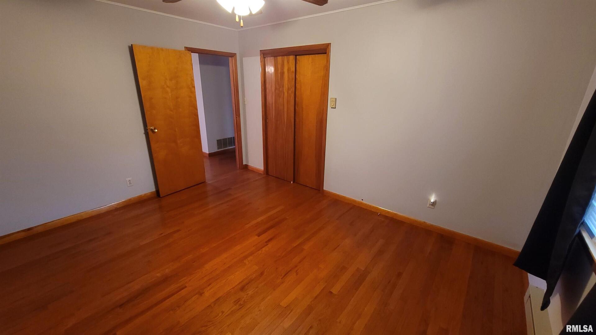 2234 Red Stripe Road Odin, IL 62870 - Photo 10 of 28 an empty room with wooden floor and closet