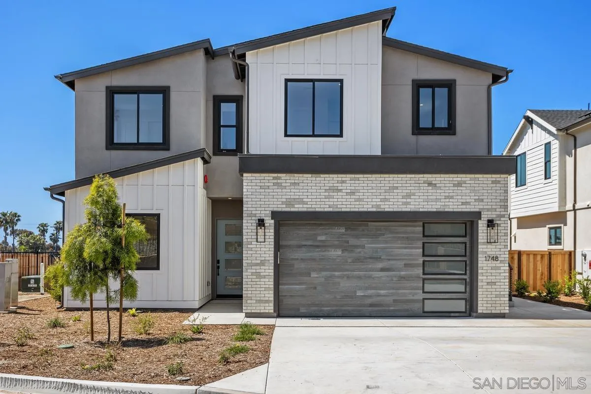 1748 Whaley Street Oceanside, CA 92054 - Photo 1 of 38 a front view of a house with garden