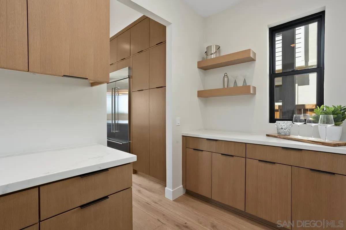 1748 Whaley Street Oceanside, CA 92054 - Photo 12 of 38 a kitchen with a sink and a refrigerator