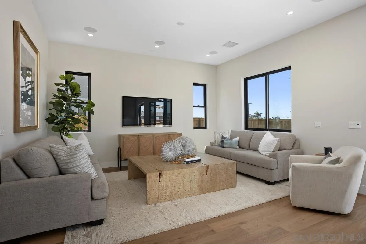 1748 Whaley Street Oceanside, CA 92054 - Photo 13 of 38 a living room with furniture and a potted plant