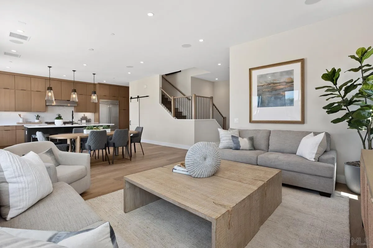 1748 Whaley Street Oceanside, CA 92054 - Photo 15 of 38 a living room with furniture kitchen view and a potted plant