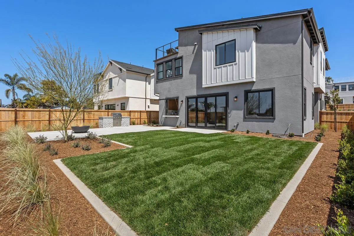1748 Whaley Street Oceanside, CA 92054 - Photo 17 of 38 a view of a house with a yard patio and a small yard