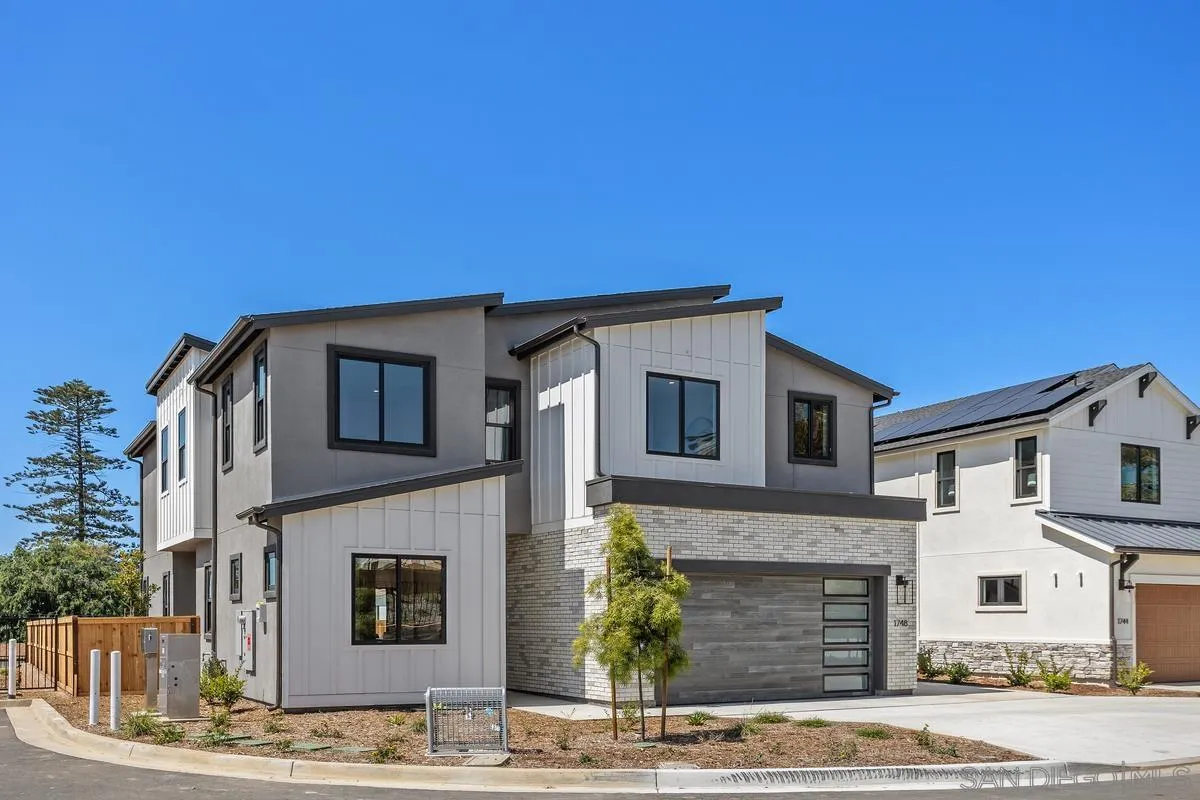 1748 Whaley Street Oceanside, CA 92054 - Photo 2 of 38 a front view of a house with yard