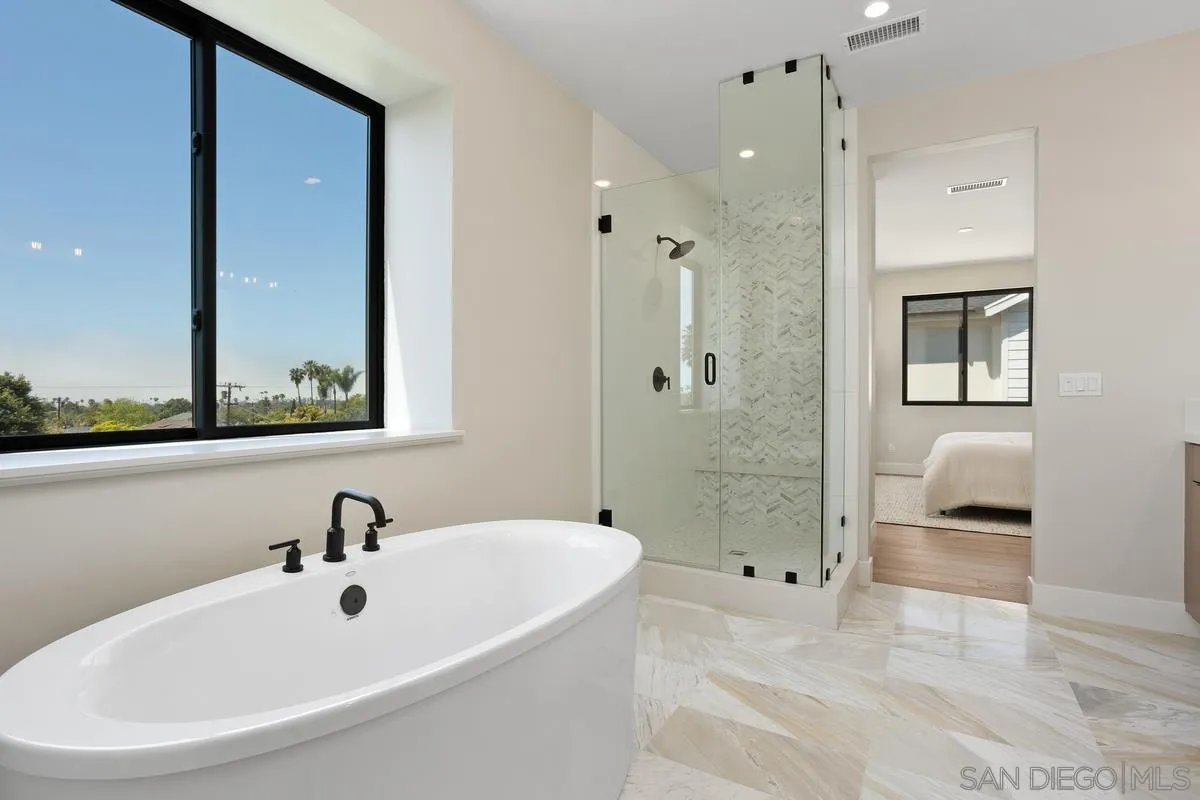 1748 Whaley Street Oceanside, CA 92054 - Photo 24 of 38 a bathroom with a bathtub and a sink