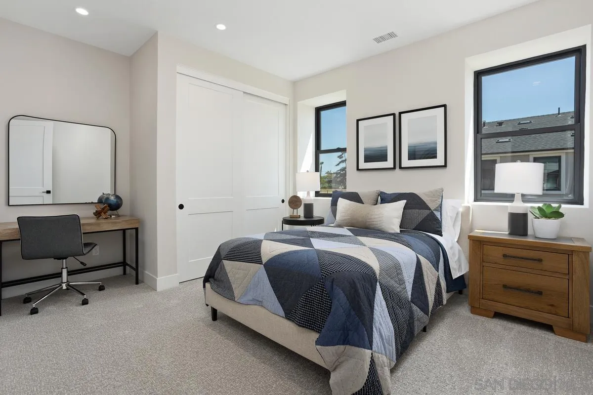 1748 Whaley Street Oceanside, CA 92054 - Photo 28 of 38 a bedroom with a bed a desk and chair