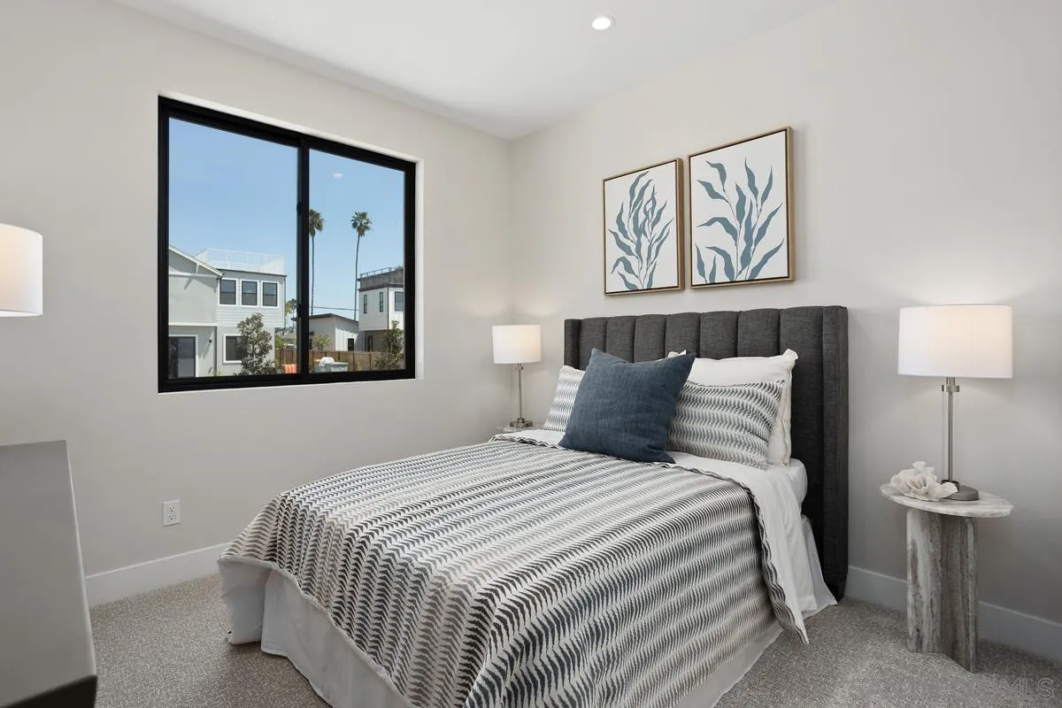 1748 Whaley Street Oceanside, CA 92054 - Photo 34 of 38 a bedroom with a bed and a painting on the wall