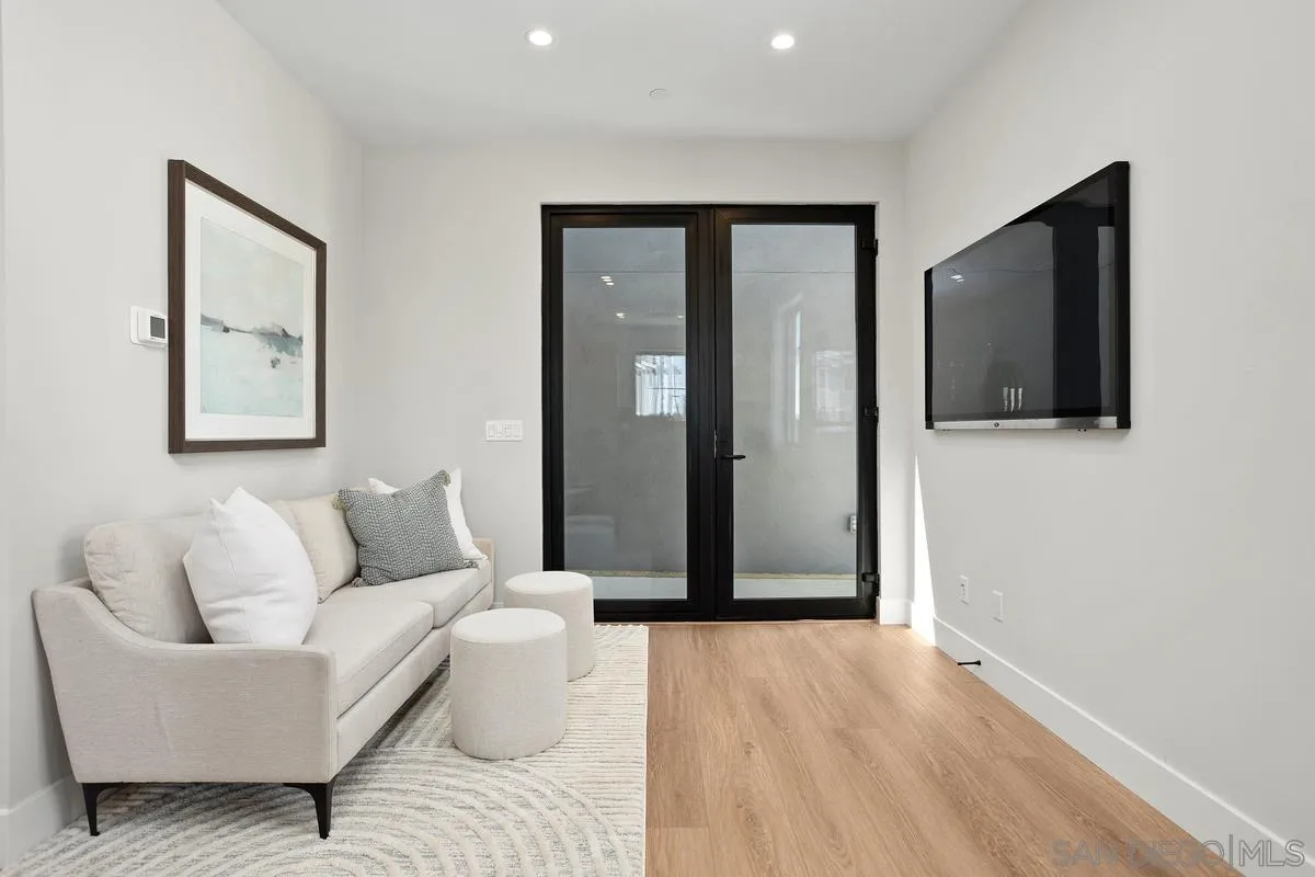 1748 Whaley Street Oceanside, CA 92054 - Photo 35 of 38 a living room with furniture and a flat screen tv