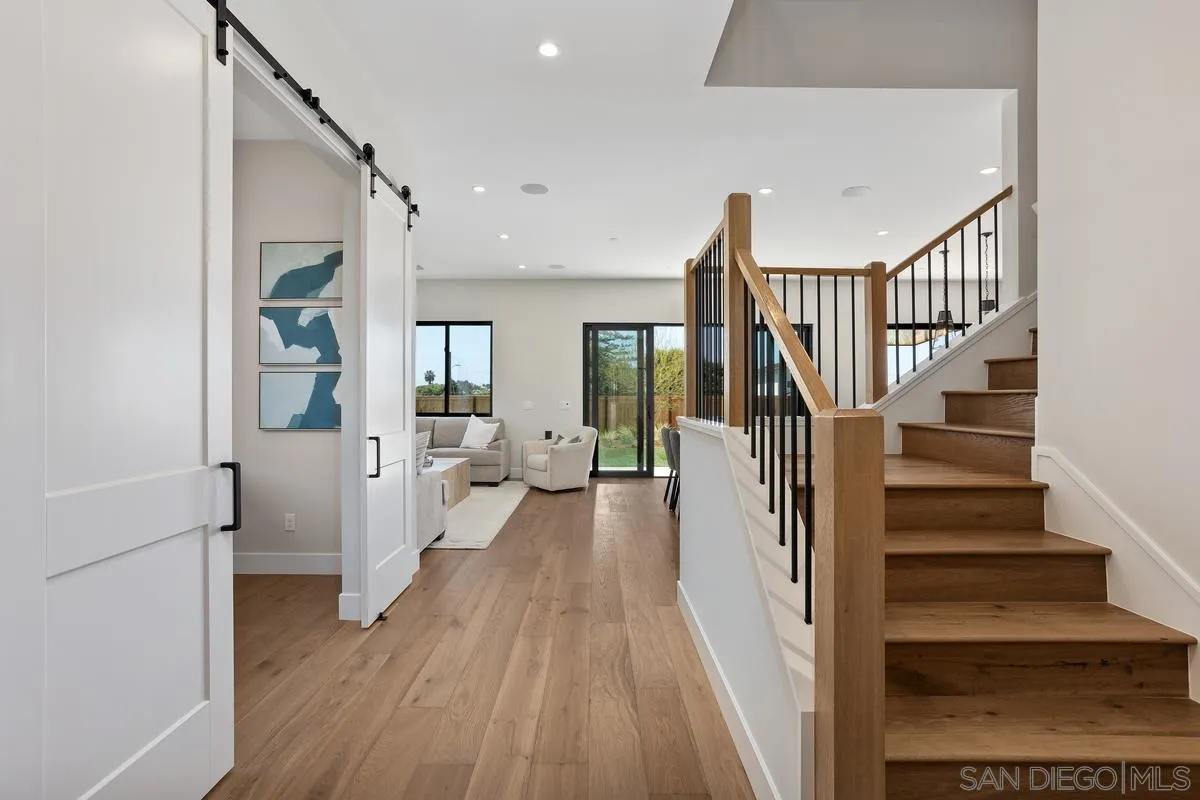 1748 Whaley Street Oceanside, CA 92054 - Photo 5 of 38 a view of a hallway view with wooden floor and staircase