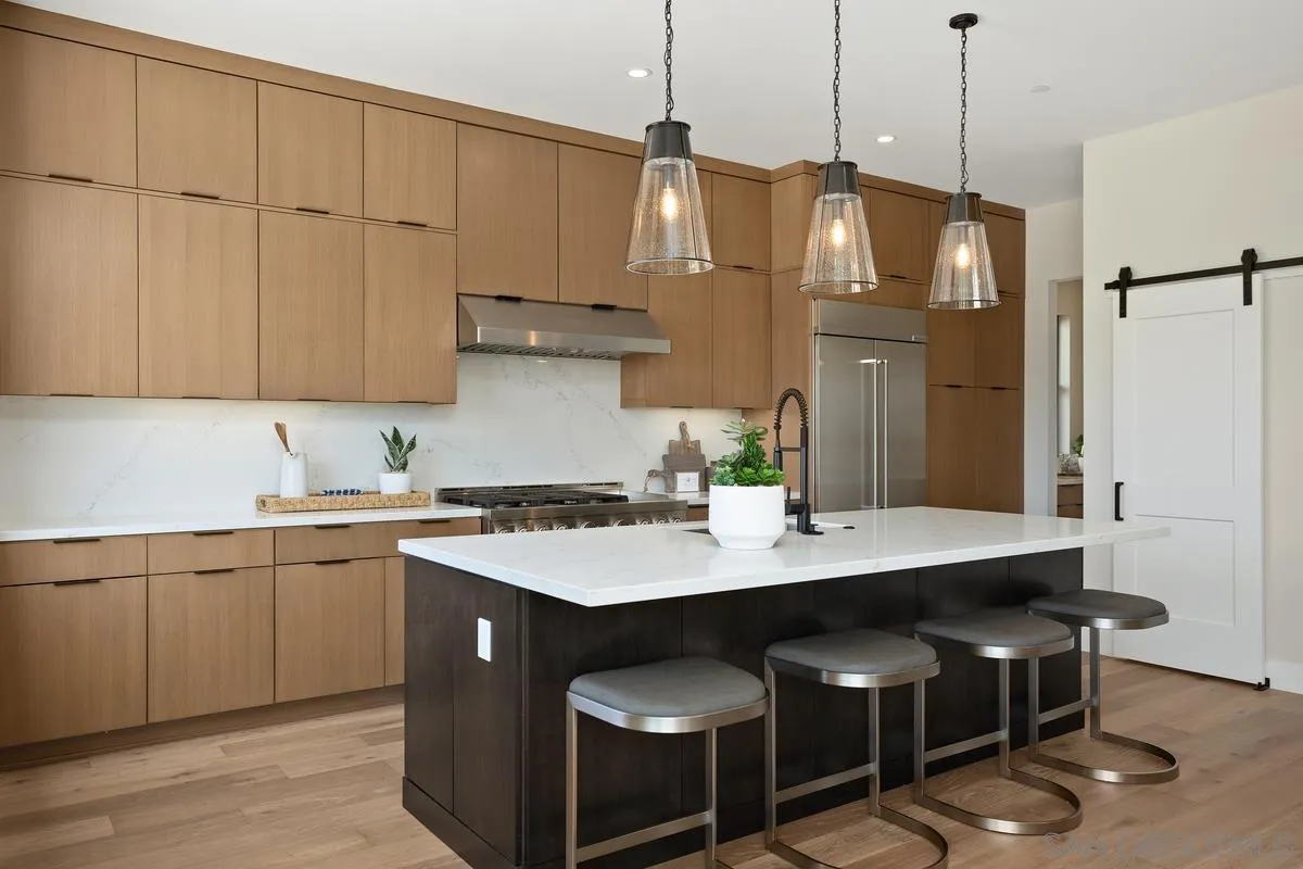 1748 Whaley Street Oceanside, CA 92054 - Photo 9 of 38 a kitchen that has a sink a refrigerator and a stove