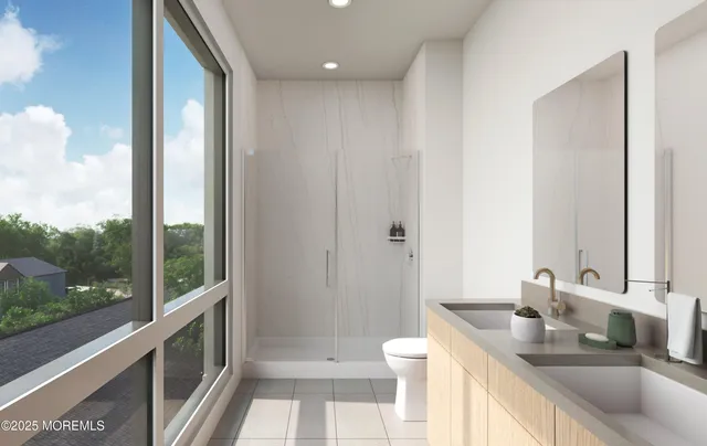 a bathroom with a granite countertop sink and a large mirror