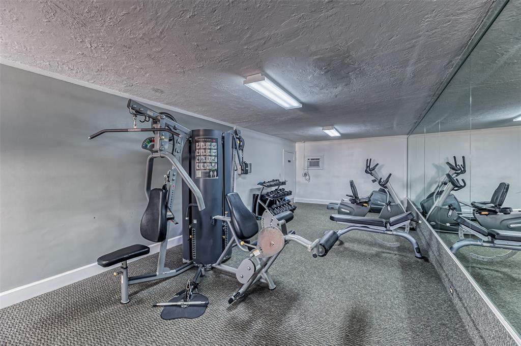 2220 Northeast 68th Street, Unit 1005 Fort Lauderdale, FL 33308 - Photo 15 of 25 a view of a room with gym equipment