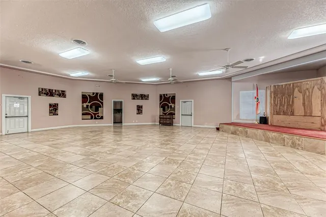 a view of a house with a yard and sitting area