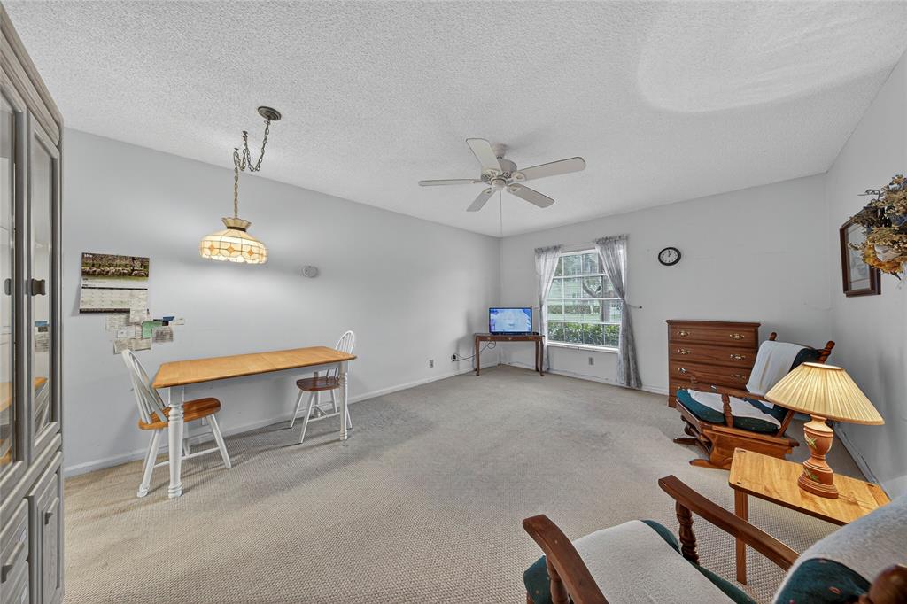 2220 Northeast 68th Street, Unit 1005 Fort Lauderdale, FL 33308 - Photo 4 of 25 a room with furniture