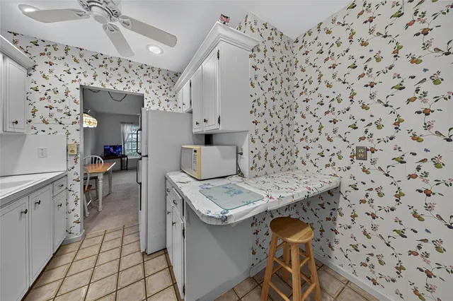 a kitchen with stainless steel appliances a stove a sink and a refrigerator