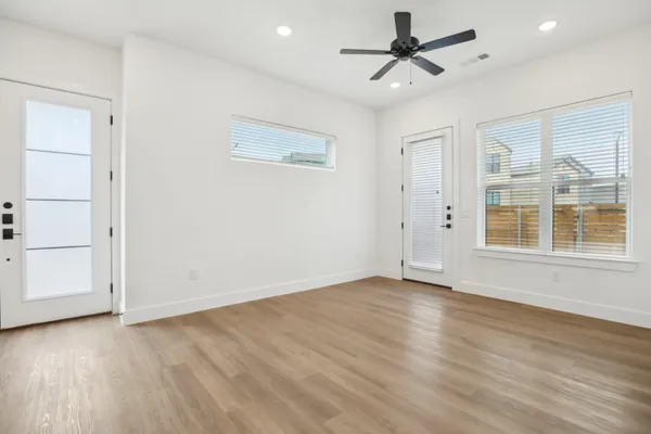 wooden floor in an empty room with a window