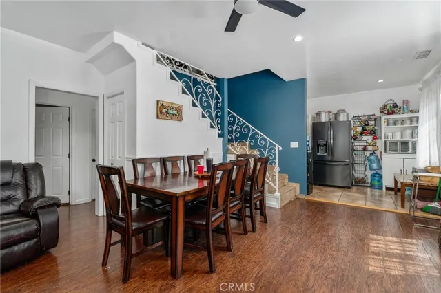 a utility room with stainless steel appliances granite countertop a sink and stove