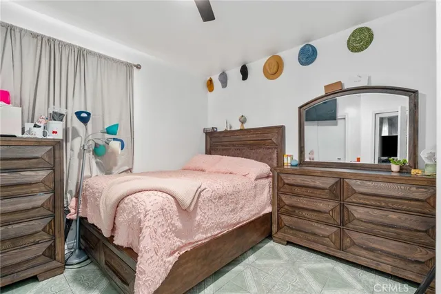 a bedroom with a bed and a lamp