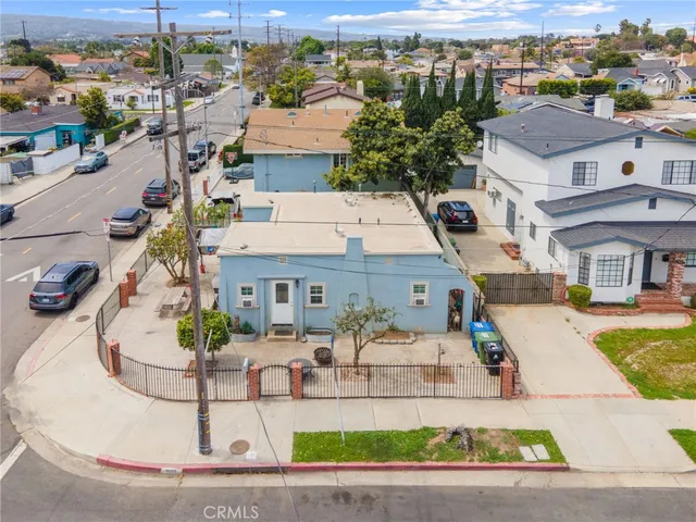 an aerial view of a house with outdoor space