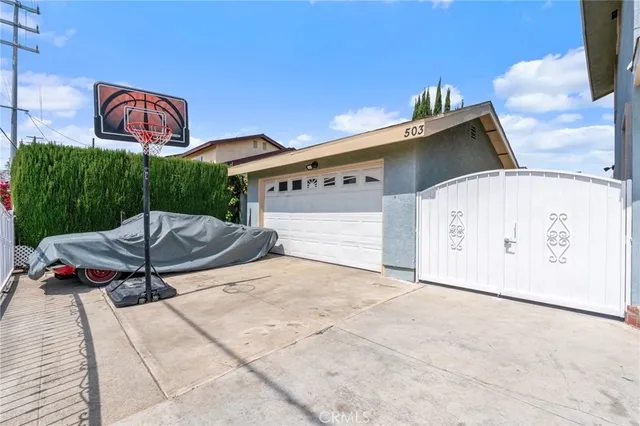 a balcony with potted plants and wooden fence