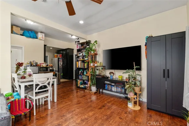 a bathroom with a granite countertop sink a mirror and shower