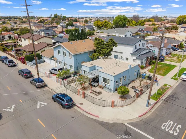 a view of a backyard with sitting area