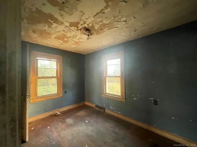 a view of an empty room and window