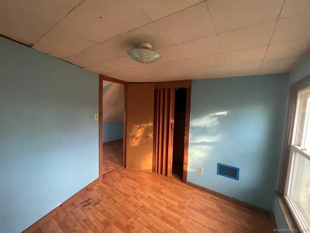 a view of an empty room with a window