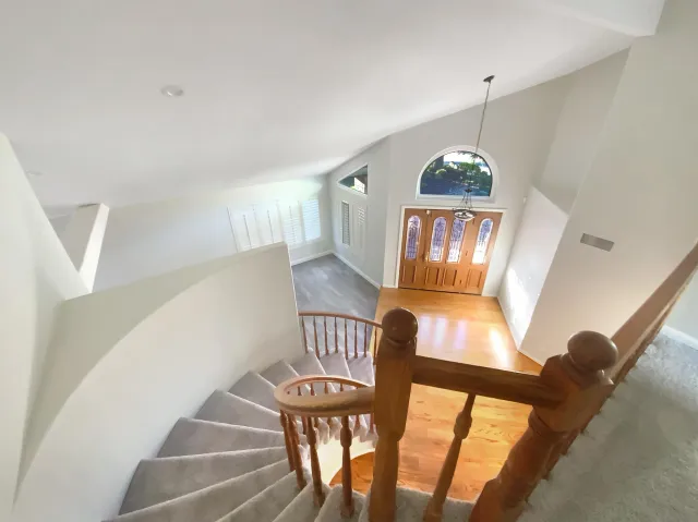 a view of a hallway with staircase