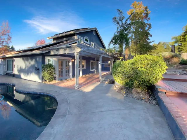 a view of a backyard of the house