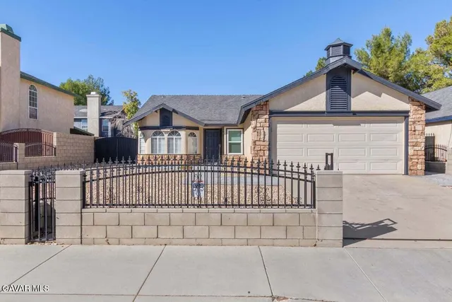 a front view of a house with a garage