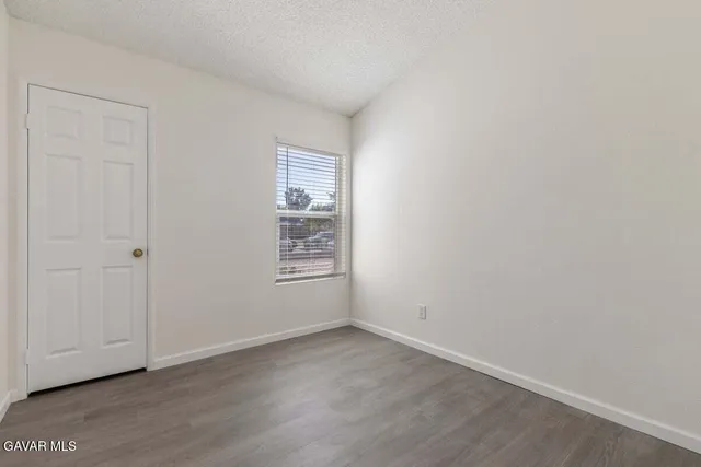 a bathroom with a sink toilet vanity and shower