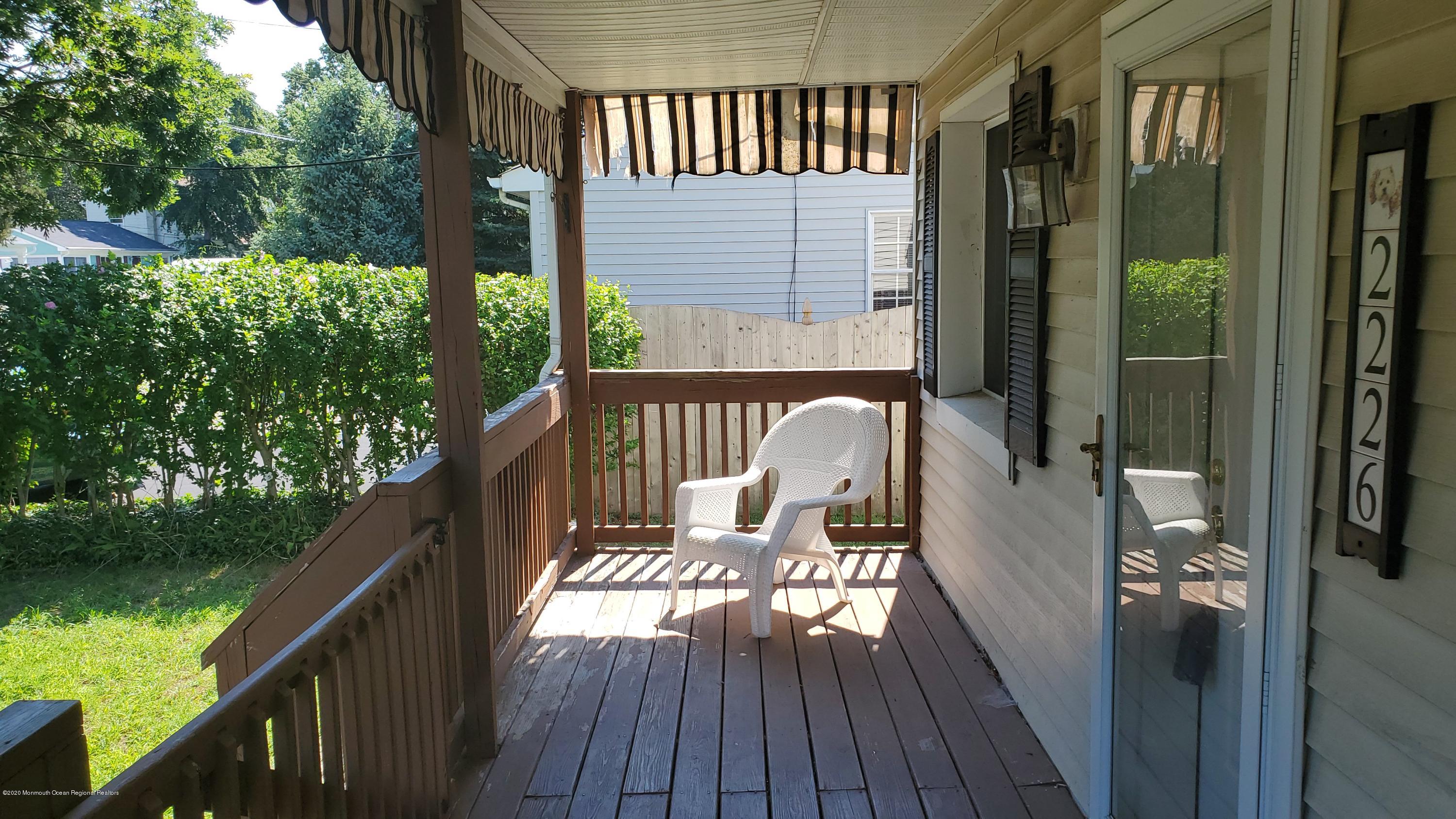 2226 Kenneth Road Point Pleasant, NJ 08742 - Photo 3 of 5 a balcony with wooden floor and outdoor space