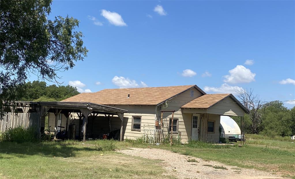 912 Taylor Avenue Rule, TX 79547 - Photo 16 of 26 a front view of a house with a yard
