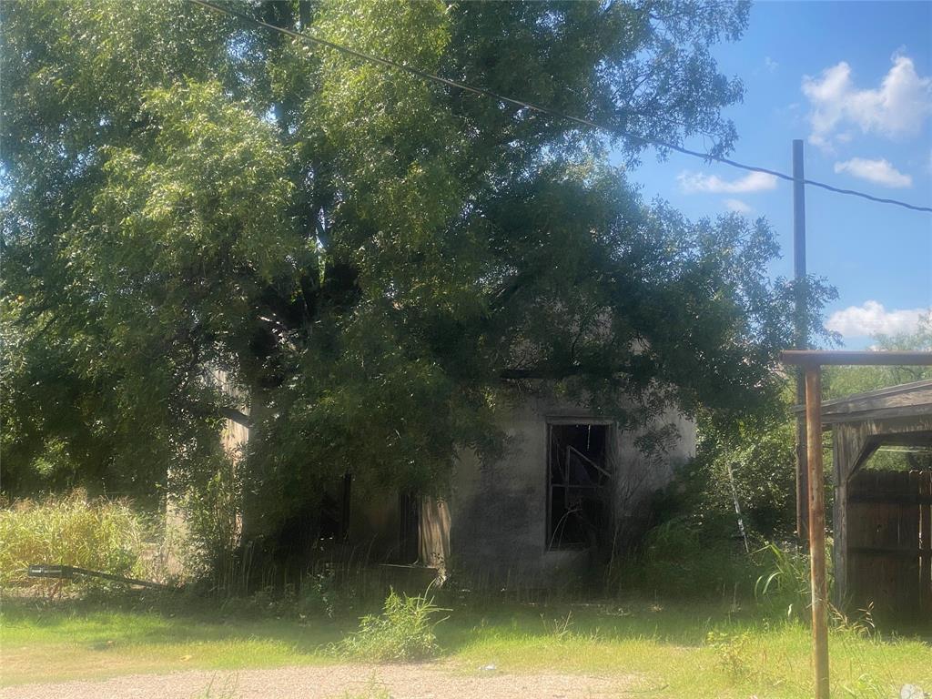 912 Taylor Avenue Rule, TX 79547 - Photo 18 of 26 a view of a house with a yard