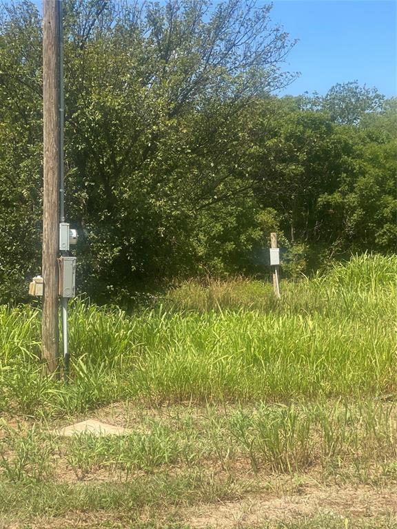 912 Taylor Avenue Rule, TX 79547 - Photo 19 of 26 a backyard of a house with lots of green space and outdoor seating