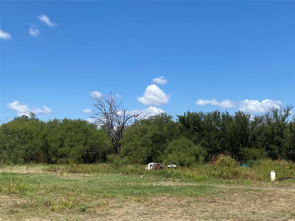 912 Taylor Avenue Rule, TX 79547 - Photo 5 of 26 a view of a green yard