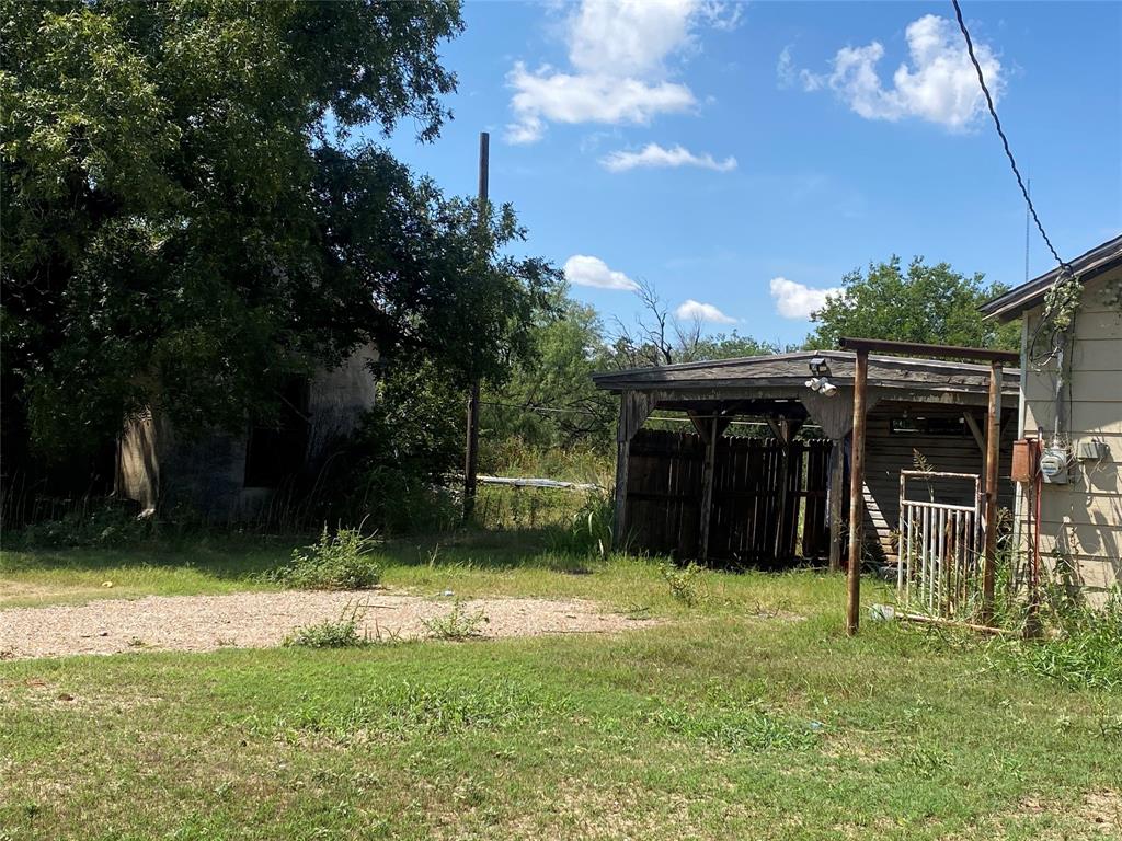 912 Taylor Avenue Rule, TX 79547 - Photo 7 of 26 a view of a backyard